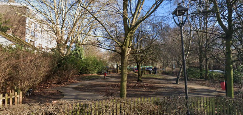 Image of dog exercise area in winter with bare trees