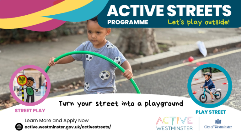 boy playing on the street with a hulahoop