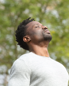 man meditating outdoors