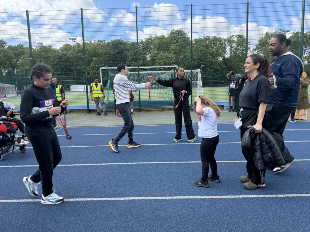 Medals being given out to participants by the members of the EA team