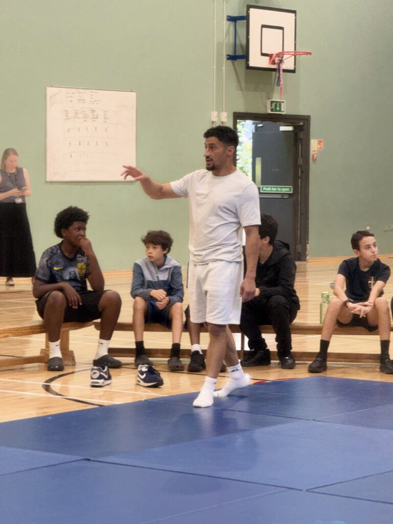 AW CotF Ashley Mckenzie talking to the kids at St Augustine's