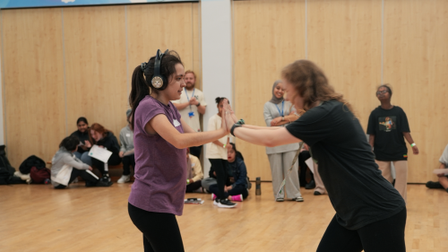 Dance Westminster 2025 - Heat 1 - College Park School - Young Disabled People. Young participant practicing their routine with their dance partner